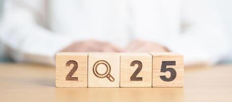 2025 block with magnifying glass icon. SEO, Search Engine Optimization, hiring , Advertising, Idea, Strategy, marketing, Keyword, Content and New Year start concepts photo