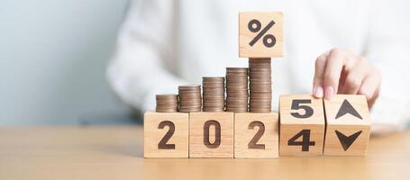 2024 to 2025 New year with percentage change to UP and Down arrow with coin stack. Interest rate, GDP, stocks market, financial, deflation and Inflation, mortgage, debt, Loan and Economic Recession photo