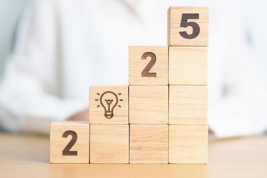 2025 year block with lightbulb. Business Idea, Creative, Thinking, brainstorm, Goal, Resolution, strategy, plan, Action, change and New Year start concepts photo