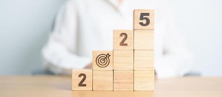 2025 year block with dartboard icon. Goal, Target, Resolution, strategy, plan, Action, mission, motivation, and New Year start concepts photo