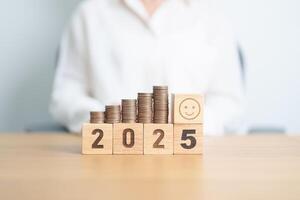 Happy New Year 2025 with Coins stack and Smile icon. goal, Money, Budget, investment, financial, savings, New Year Resolution, Satisfaction, feedback, Review and good year concept photo