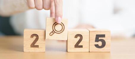 2025 block with magnifying glass icon. SEO, Search Engine Optimization, hiring , Advertising, Idea, Strategy, marketing, Keyword, Content and New Year start concepts photo