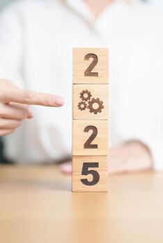 2024 year change to 2025 year block with gear icon. Business Process, Team, teamwork, Goal, Target, Resolution, strategy, plan, Action, motivation, change, brainstorm and New Year start concepts photo
