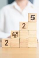 2025 year block with dartboard icon. Goal, Target, Resolution, strategy, plan, Action, mission, motivation, and New Year start concepts photo