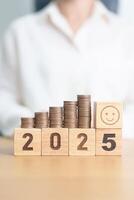 Happy New Year 2025 with Coins stack and Smile icon. goal, Money, Budget, investment, financial, savings, New Year Resolution, Satisfaction, feedback, Review and good year concept photo