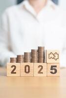 Happy New Year 2025 with Coins stack and jigsaw puzzle icon. business Process, Team, teamwork, Strategy, goal, Money, Budget, investment, financial and New Year Resolution concept photo