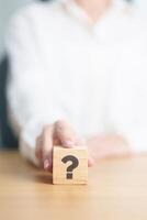 Wood block of Questions Mark sign. FAQ, frequency asked questions, Answer, Q and A, Information, Communication and interrogation Concepts photo