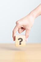 Wood block of Questions Mark sign. FAQ, frequency asked questions, Answer, Q and A, Information, Communication and interrogation Concepts photo