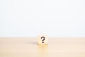 Wood block of Questions Mark sign. FAQ, frequency asked questions, Answer, Q and A, Information, Communication and interrogation Concepts photo