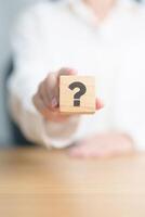 Wood block of Questions Mark sign. FAQ, frequency asked questions, Answer, Q and A, Information, Communication and interrogation Concepts photo