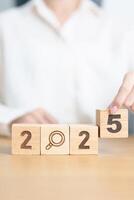 2025 block with magnifying glass icon. SEO, Search Engine Optimization, hiring , Advertising, Idea, Strategy, marketing, Keyword, Content and New Year start concepts photo