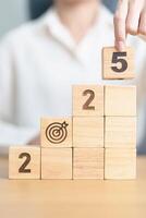 2025 year block with dartboard icon. Goal, Target, Resolution, strategy, plan, Action, mission, motivation, and New Year start concepts photo