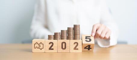 2024 end year to Happy New Year 2025 with Coins stack and jigsaw puzzle icon. business Process, Team, teamwork, Strategy, goal, Money, Budget, investment, financial and New Year Resolution concept photo