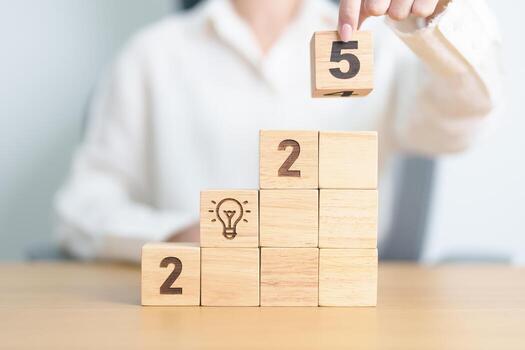 2025 year block with lightbulb. Business Idea, Creative, Thinking, brainstorm, Goal, Resolution, strategy, plan, Action, change and New Year start concepts photo