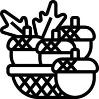 A basket with acorns and leaves in it vector