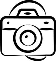A camera is shown in black and white vector