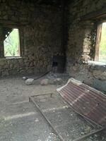Old Bed in An Abandoned Stone Cabin in Arizona Desert photo