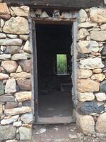 Doorway of An Abandoned Stone Cabin in Arizona Desert photo