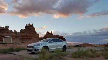 Sunset, Car Parked at Goblin Valley State Park Campground in Utah photo