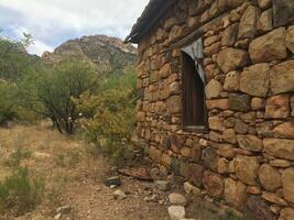 An Abandoned Stone Cabin in Arizona Desert photo