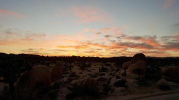 Sunset with Boulders Landscape in Joshua Tree National Park, California photo