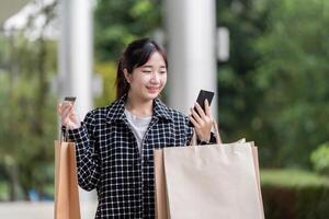 Black Friday Shopper Excitedly Using Mobile for Seamless Shopping Experience photo