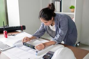Engineer Using Level Tool for Project Accuracy and Design in Office photo