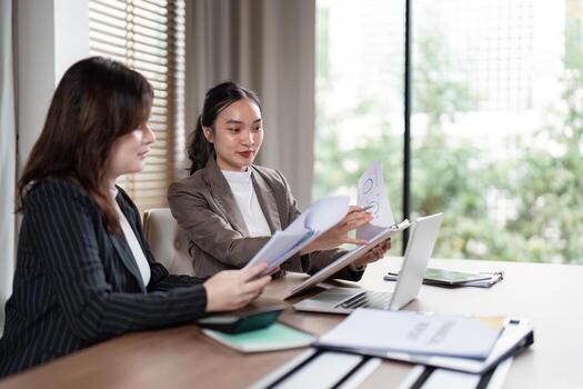 Business Team Analyzing Reports for Strategic Planning. Concept of Teamwork and Data-Driven Decision Making photo