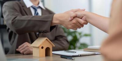Trustworthy Real Estate Agent Concluding Deal with Client Through Solid Handshake photo