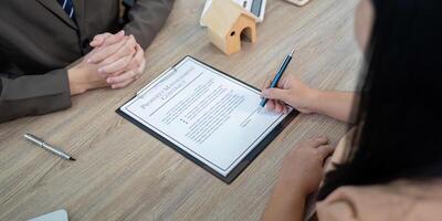 Real Estate Agent Guiding Client Through Property Management Contract Discussion photo