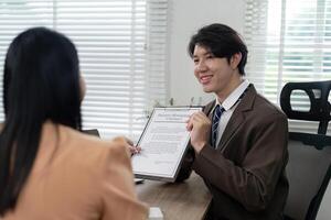 Enthusiastic Real Estate Agent Presenting Property Management Contract to Client photo