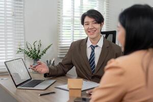 Real Estate Agent Discussing Housing Opportunities with Potential Buyer photo
