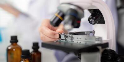 Close up on Scientist Conducting Precision Analysis with Laboratory Microscope photo