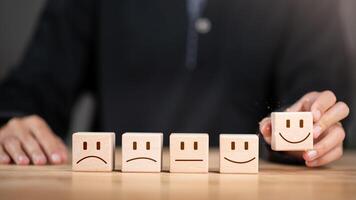 Consumer showing satisfaction rating concept with wooden blocks ,evaluation business success ,Services and Products and Customer Engagement ,Online ratings and reviews ,Quality Assessment photo