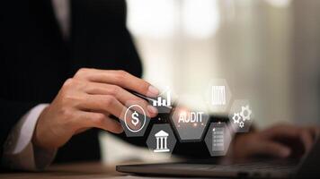 Accountant showing office document auditing concept ,plan review process and assess correctness ,Management of important document storage of organization ,document system ,accountant Audit documents photo