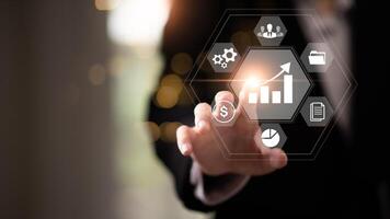 Businessman showing business growth and success graph ,concept of progress in development, financial efficiency and investment with business strategy for goals and opportunities in the industry future photo