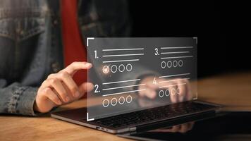 The man chooses the correct answer, marking online,online survey concept online exam filling out survey forms,using technology for education,learning assessment through online documents photo