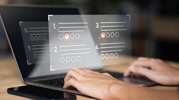 The man chooses the correct answer, marking online,online survey concept online exam filling out survey forms,using technology for education,learning assessment through online documents photo