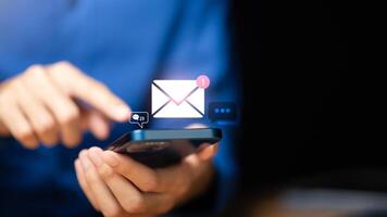 man reading electronic mail ,Email marketing and newsletter concept,Digital communication with email messages,Sending and receiving messages online with the email icon ,notifications photo