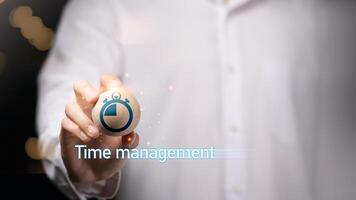 Businessman showing virtual icon in hand, time management concept,effective business planning,time management in the organization,Agreement and solution photo