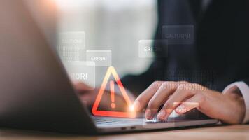 Programmer and virtual icons , exclamation mark ,alarm,computer virus detected ,danger warning concept or information error that should be urgently fixed and repaired ,Notification of security issues photo