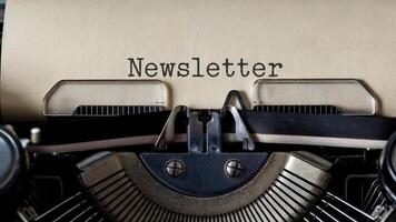 Old-fashioned newsletter typed on aged paper with vintage typewriter for retro communication concept photo