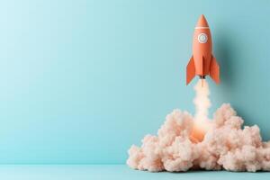 red rocket taking off against a blue background with copy space photo