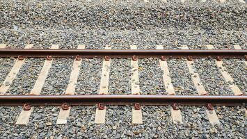 Railway tracks in the train station, closeup of photo. photo