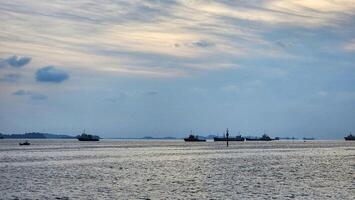 a large body of water with several ships in it photo