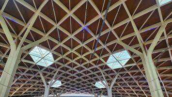 the ceiling of a train station with many windows photo