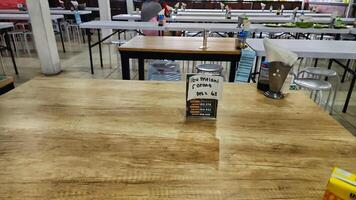 a table with a bottle of ketchup on it photo