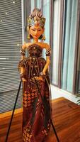 Wayang golek is a three-dimensional performing art made from wood that is carved to resemble humans, then dressed up with cloth as clothing to make it more attractive. photo
