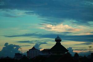 a view of the sky with clouds and buildings photo