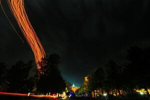 a long exposure photograph of a long streak of light photo